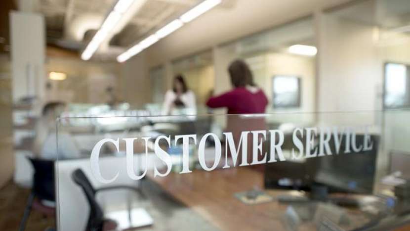 Branch lobby with customer service sign in focus