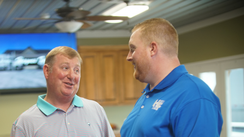 Banker and customer talking in place of business