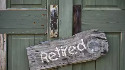 Door with Retired sign on it