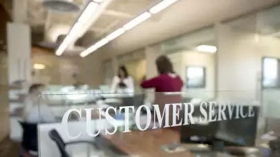 Branch lobby with customer service sign in focus
