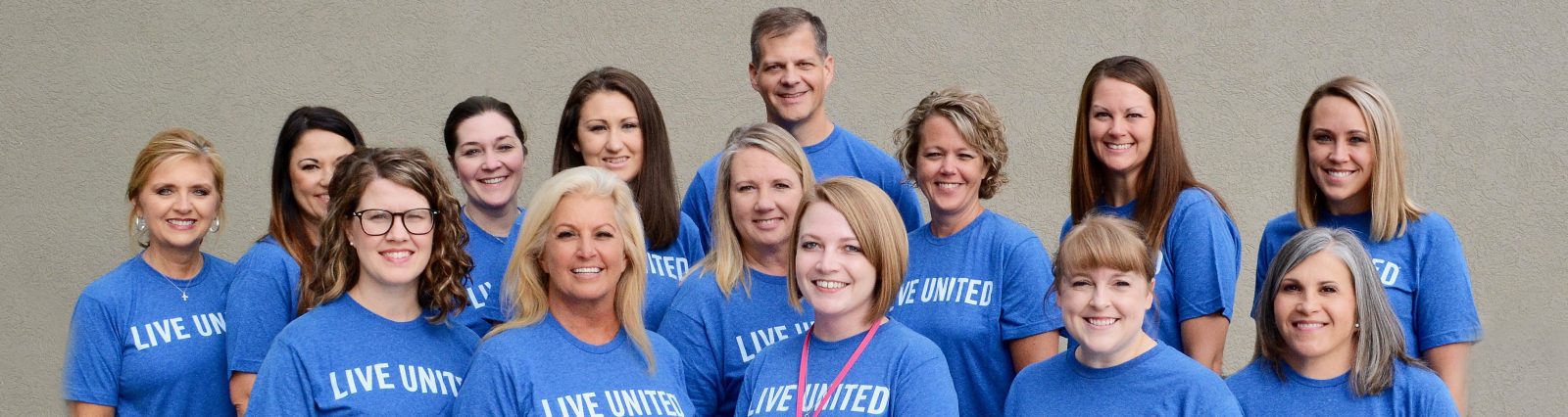 Puts Community First - Group of people wearing United Way serve shirts
